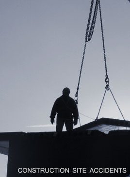 A man standing on top of a building under construction.